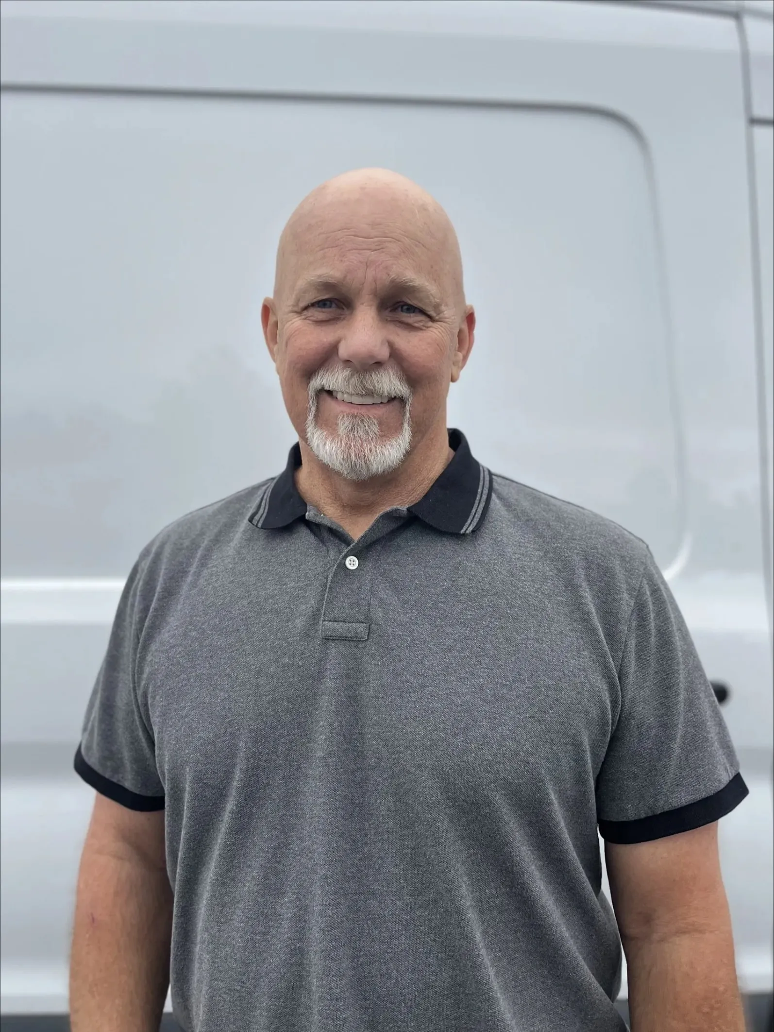 Ron Beesley, owner, in front of a company van